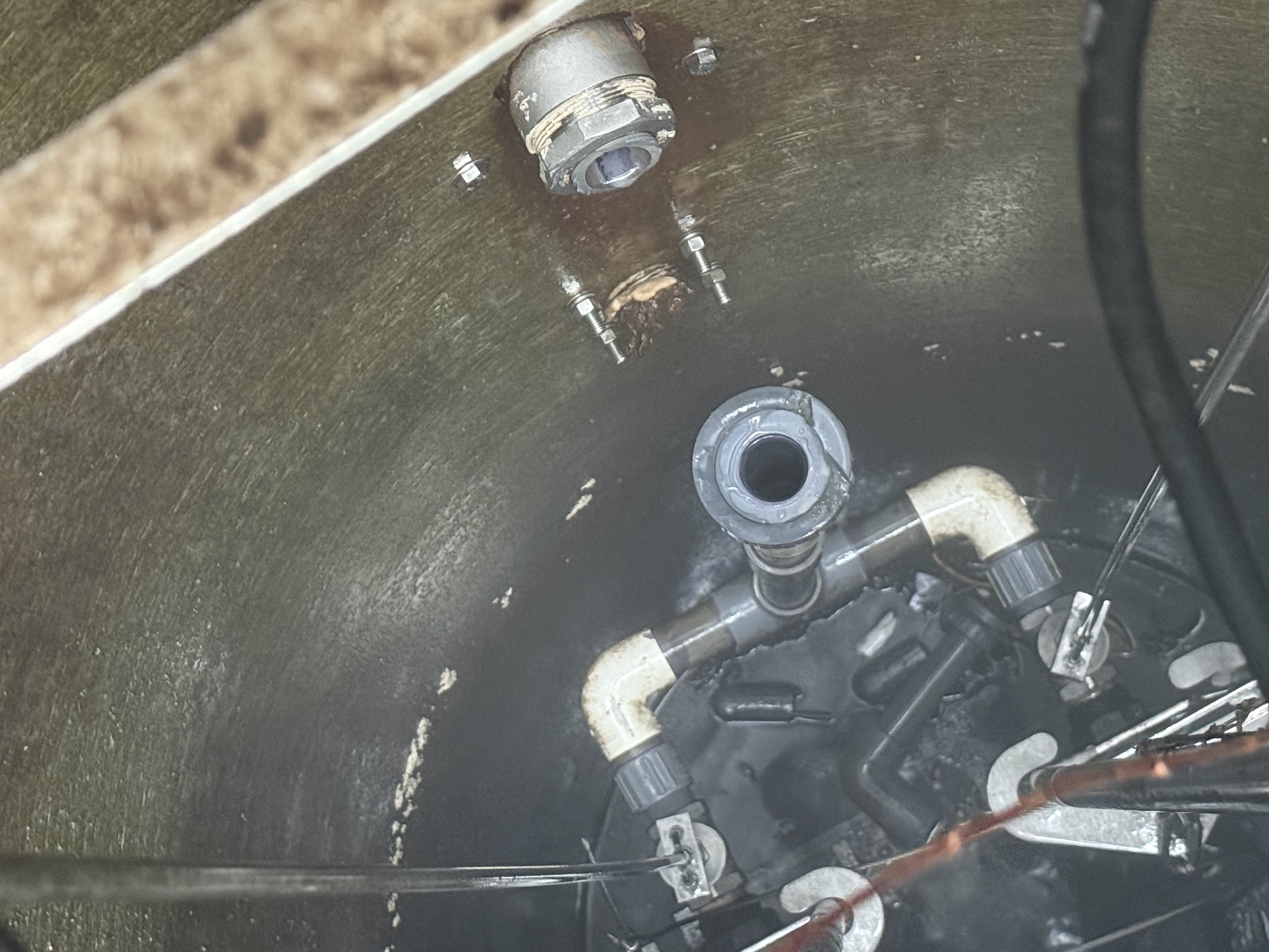 Inside a septic tank and lift station serviced by Emergency Rooter